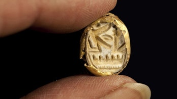 Israeli archaeologists uncover 3,300-year-old coffin, gold signet