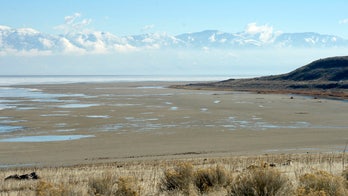 Beached boats, pink water as drought saps Great Salt Lake