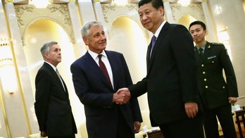 China's military unveils new warplane ahead of Hagel visit