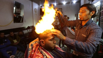 A cut above? Barber styles hair with a blowtorch