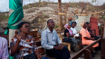 Haitians worship among devastation caused by hurricane