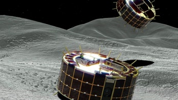 Japan lowers rovers onto 'dumpling' asteroid, hopeful of historic touchdown