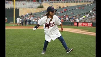 8-year-old with 3-D printed hand reaches halfway mark in bid to pitch at every MLB stadium