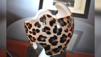 Company offers free custom wraps for infant helmets