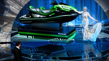 Helen Mirren takes a shot of tequila on the Oscars red carpet