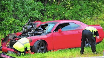 Dodge Challenger wrecked in front of car museum