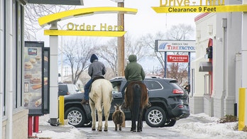 Boys saddle up for a trip to McDonald's with their pet goat