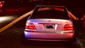 Busted! Firefighters break illegally parked car's windows to run hose through it
