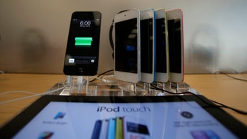 Apple Stores demote the iconic iPod from display tables to the wall rack