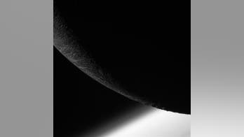NASA releases stunning image from Cassini's final close Enceladus flyby