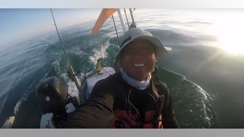 VIRAL VIDEO: Kayaker saves struggling iguana miles away from Florida coast