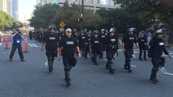 Protesters kneel during National Anthem outside Panthers-Vikings game amid increased police presence