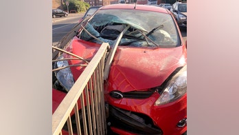 Rod impales car windshield in crash, misses driver's head by inches