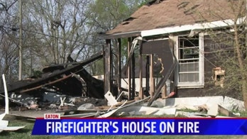Volunteer Indiana firefighter battles fire at his own home