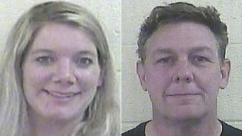 Indiana couple accused of locking daughter in cage without food, water
