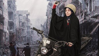 Iran lets citizens pose for photos in front of Syrian war scenes