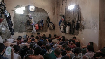 Iraqis hold suspected ISIS militants in cramped, stifling prison who say they 'want to die'