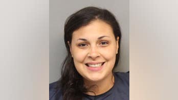 Woman flashes toothy smile in mugshot after allegedly slashing boyfriend with sword
