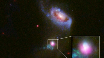 Monster black hole unleashes messy double 'burp'