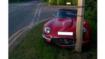 Classic Jaguar E-Type crashed into lamppost after restoration