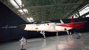 Japan unveils stealth plane, may combine with next-gen jet
