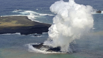 Volcanic eruption creates new island far south of Japan