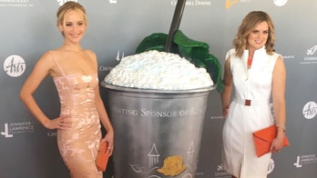 Jennifer Lawrence attends event in pizza-stained dress
