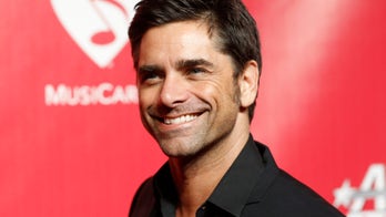 John Stamos helps turn on Xmas lights at Graceland