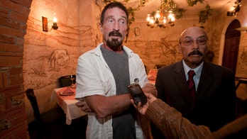 Software founder McAfee says he'll seek asylum in Guatemala