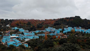 Spain's 'Smurf Village,' though popular with tourists, must cease references to the Smurfs