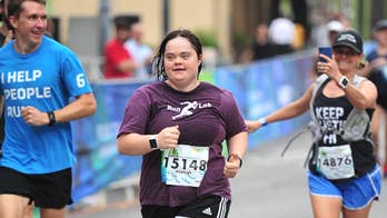 Runner with Down syndrome dances her way through half marathon finish line