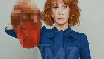 Kathy Griffin returns to stage donning Trump mask, giving middle finger