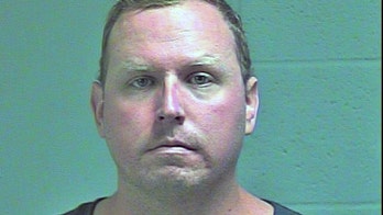 Oklahoma cop charged with murder in shooting of suicidal man