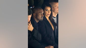 Kim and Kanye flash their cleavage and get booed in Paris