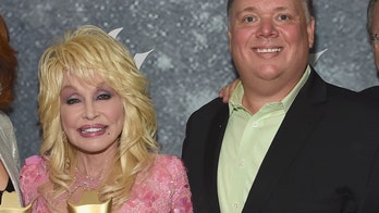 Dolly Parton called out by sister for posing with axed publicist Kirt Webster at CMA Awards