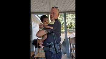 Family asks cop to be baby's godfather after he saves her from choking