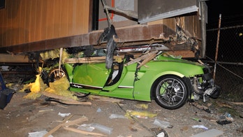 Suspected drunk driver wedges Lamborghini underneath trailer, police say