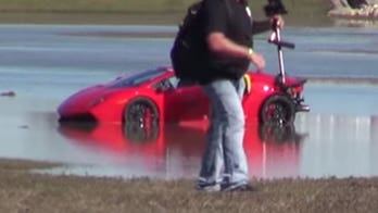 Watch a Lamborghini take a wet and wild ride