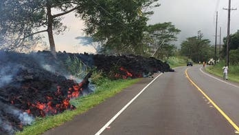 Hawaii volcano lava flow destroys over 70 homes, utility poles as it cuts off key highway