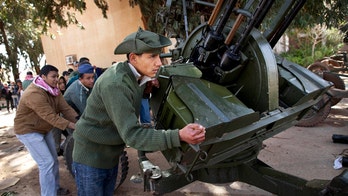 Libya at Risk of Civil War as International Community Aims to Isolate Muammar al-Qaddafi