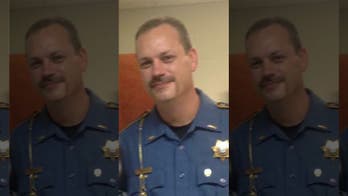 Slain Arkansas cop honored as murder suspect pleads not guilty