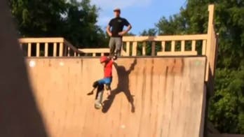 Shocking moment dad kicks son, 6, off half-pipe in skate park