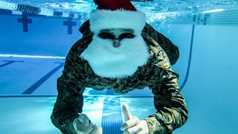 Marines dressed as Santa in holiday-themed underwater photoshoot