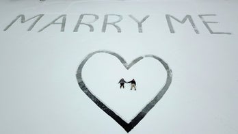 Aviation student's 'Marry Me' proposal seen, and accepted, in the air