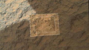 Curiosity rover touches 1st Martian rock