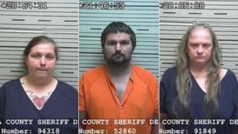 Boy, 13, found naked, chained in Alabama home was forced to sleep in dog crate, officials say