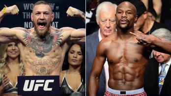 UFC sensation McGregor stirs talk of nearly $1B super-fight with boxing legend Mayweather