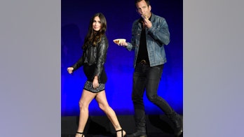 Megan Fox debuts baby bump at CinemaCon