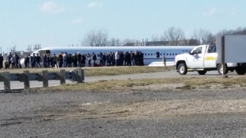 Plane carrying University of Michigan men's basketball team slides off runway