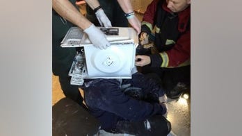 Firefighters slam YouTube prankster who 'cemented' a microwave oven to his head